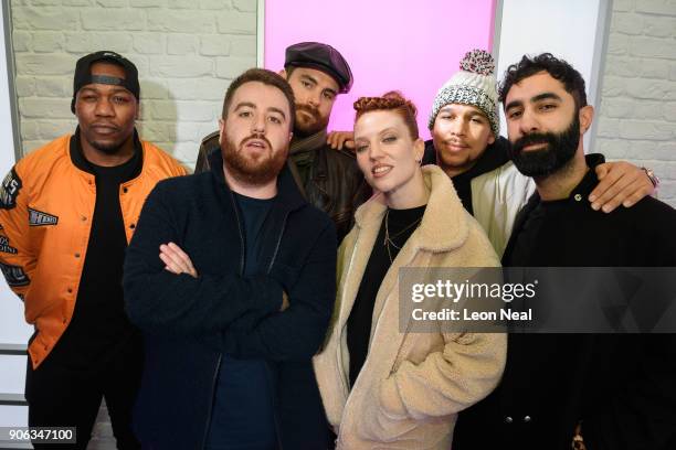 Radio DJ Tom Green stands with English singer Jess Glynne and DJ Locksmith , Piers Aggett , Kesi Dryden and Amir Amor of UK group Rudimental as they...