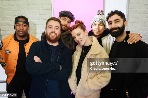 Radio DJ Tom Green stands with English singer Jess Glynne and DJ Locksmith , Piers Aggett , Kesi Dryden and Amir Amor of UK group Rudimental as they...