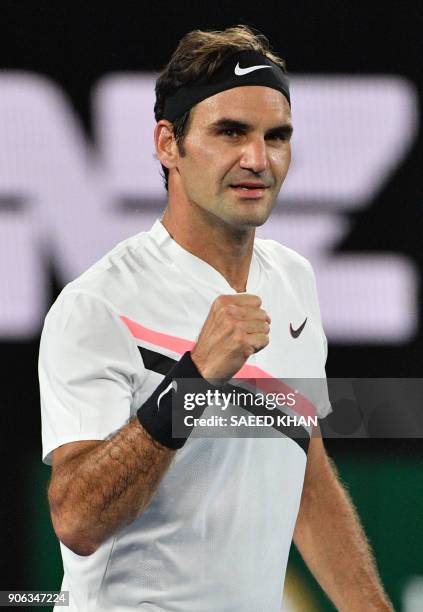 Switzerland's Roger Federer celebrates beating Germany's Jan-Lennard Struff in their men's singles second round match on day four of the Australian...