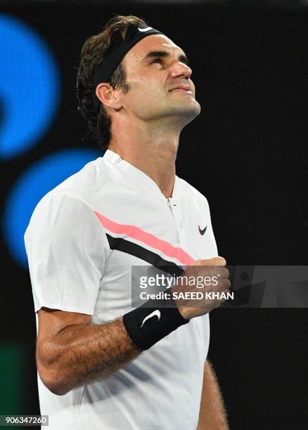 Switzerland's Roger Federer celebrates beating Germany's Jan-Lennard Struff in their men's singles second round match on day four of the Australian...