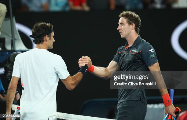 Roger Federer of Switzerland shakes hands at the net after his straight sets victory in his second round match against Jan-Lennard Struff of Germany...