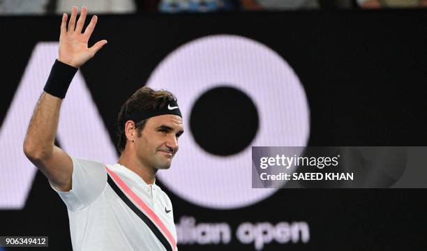 Switzerland's Roger Federer reacts after beating Germany's Jan-Lennard Struff in their men's singles second round match on day four of the Australian...