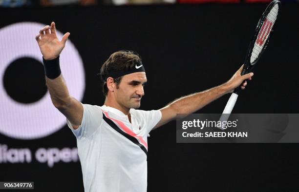 Switzerland's Roger Federer reacts after beating Germany's Jan-Lennard Struff in their men's singles second round match on day four of the Australian...