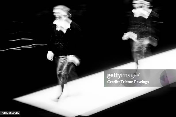Models walk the runway at the Giorgio Armani show during Milan Men's Fashion Week Fall/Winter 2018/19 on January 15, 2018 in Milan, Italy.