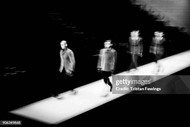 Models walk the runway at the Giorgio Armani show during Milan Men's Fashion Week Fall/Winter 2018/19 on January 15, 2018 in Milan, Italy.