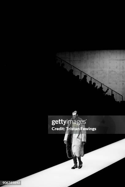 Model walks the runway at the Giorgio Armani show during Milan Men's Fashion Week Fall/Winter 2018/19 on January 15, 2018 in Milan, Italy.