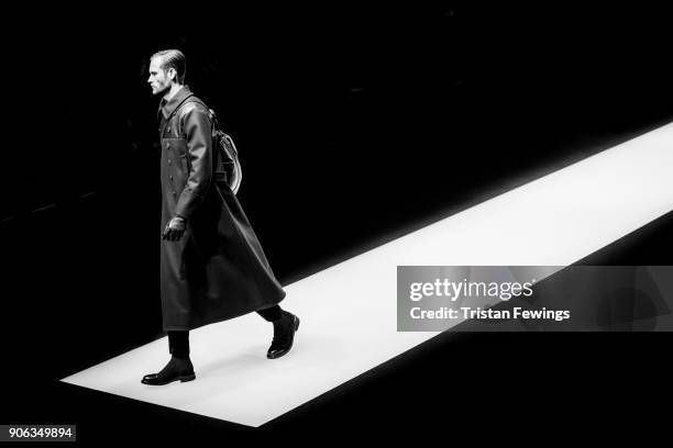 Model walks the runway at the Giorgio Armani show during Milan Men's Fashion Week Fall/Winter 2018/19 on January 15, 2018 in Milan, Italy.