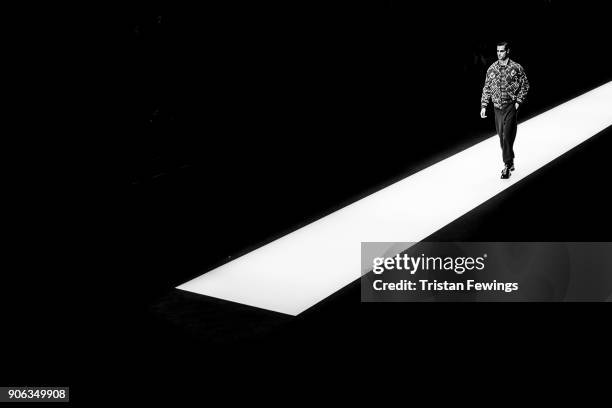 Model walks the runway at the Giorgio Armani show during Milan Men's Fashion Week Fall/Winter 2018/19 on January 15, 2018 in Milan, Italy.