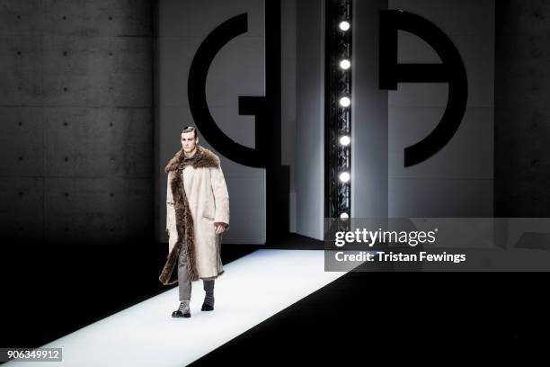 Model walks the runway at the Giorgio Armani show during Milan Men's Fashion Week Fall/Winter 2018/19 on January 15, 2018 in Milan, Italy.