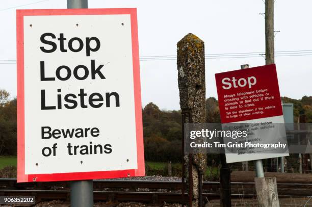 warning signs next to a railway crossing. - railway crossing stock pictures, royalty-free photos & images