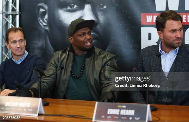 Dillian Whyte speaks alongside trainer Mark Tibbs and promoter Eddie Hearn during a press conference for the heavyweight fight between Dillian Whyte...