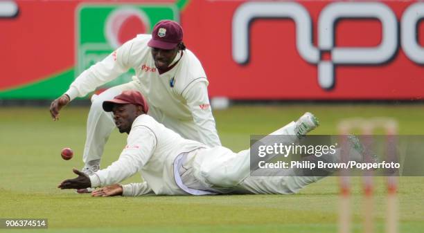 West Indies fielders Chris Gayle and Devon Smith fail to take a catch to dismiss England's Stuart Broad during the 1st Test match between England and...