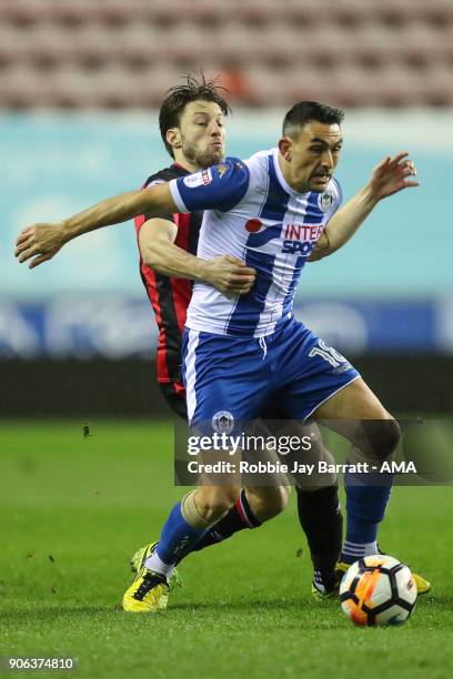 Harry Arter of Bournemouth and Gary Roberts of Wigan Athletic during The Emirates FA Cup Third Round Replay between Wigan Athletic v AFC Bournemouth...