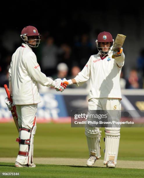 West Indies batsman Brendan Nash celebrates reaching 50 runs with Denesh Ramdin during the 1st Test match between England and West Indies at Lord's...