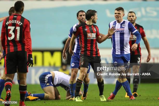 Harry Arter of Bournemouth and Max Power of Wigan Athletic have a disagreement during The Emirates FA Cup Third Round Replay between Wigan Athletic v...