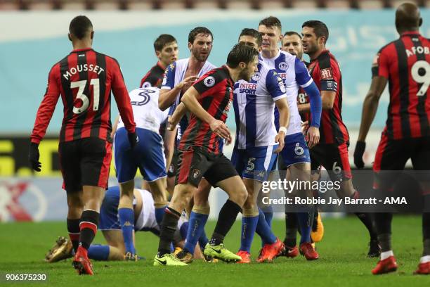 Harry Arter of Bournemouth and Max Power of Wigan Athletic have a disagreement during The Emirates FA Cup Third Round Replay between Wigan Athletic v...