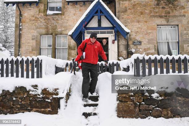 Postman delivers mail in the snow on January 18, 2018 in Leadhills, Scotland. Motorists are being warned to drive with caution as snow and icy...