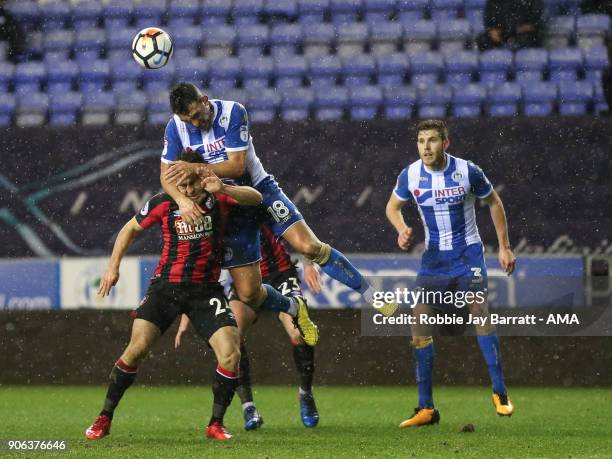 Ryan Fraser of Bournemouth and Gary Roberts of Wigan Athletic during The Emirates FA Cup Third Round Replay between Wigan Athletic v AFC Bournemouth...