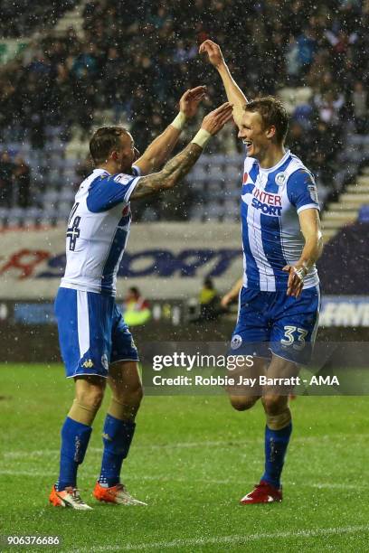 Dan Burn of Wigan Athletic celebrates after scoring a goal to make it 2-0 during The Emirates FA Cup Third Round Replay between Wigan Athletic v AFC...