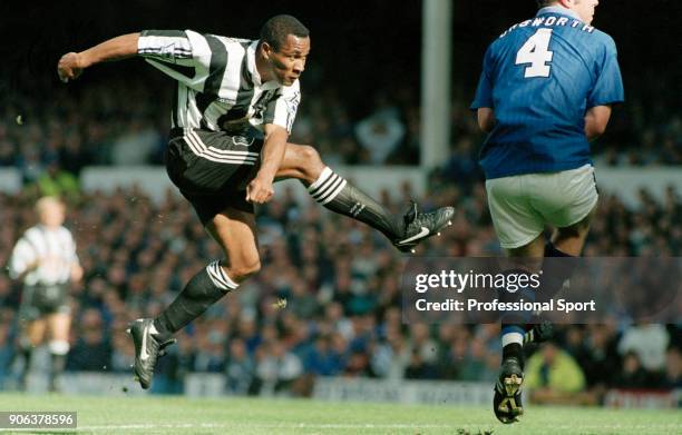 Les Ferdinand of Newcastle United scores the 1st goal as David Unsworth of Everton attemps to block during an FA Carling Premiership match at...