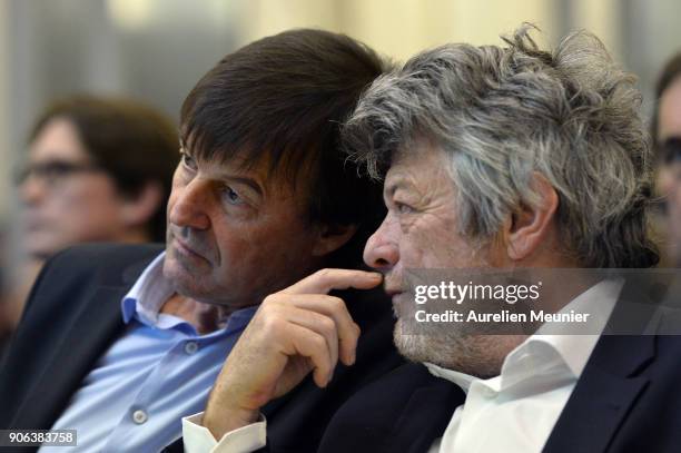 French Ecology Minister Nicolas Hulot and Former French Minister Jean Louis Borloo react during a press conference at Ministry of Ecology on January...