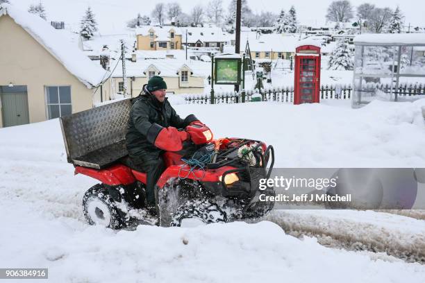 Shepherd rides his quad bike following extensive snowfall during the last forty eight hours on January 18, 2018 in Leadhills, Scotland. Motorists are...