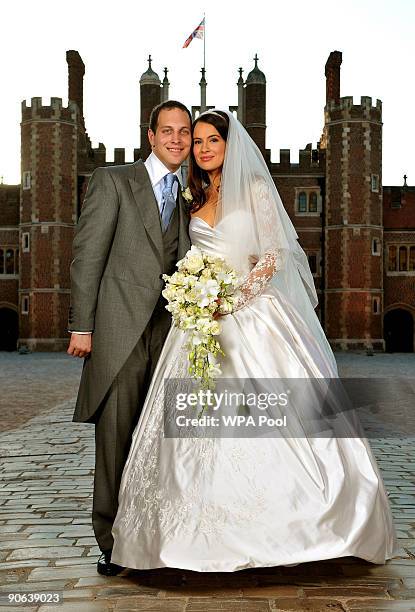 Lord Freddie Windsor poses with his bride Sophie Winkleman in the Base Court, minutes after their wedding in the Chapel Royal at Hampton Court Palace...