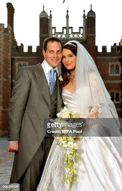 Lord Freddie Windsor poses with his bride Sophie Winkleman in the Base Court, minutes after their wedding in the Chapel Royal at Hampton Court Palace...