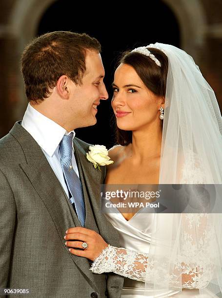 Lord Freddie Windsor poses with his bride Sophie Winkleman in the Base Court, minutes after their wedding in the Chapel Royal at Hampton Court Palace...