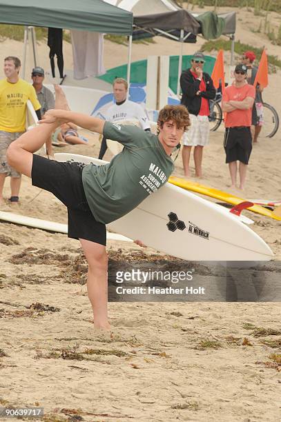 Eric Balfour does some stretches before his surf at the 4th Annual Surfrider Foundation Celebrity Expression Session on September 12, 2009 in Malibu,...