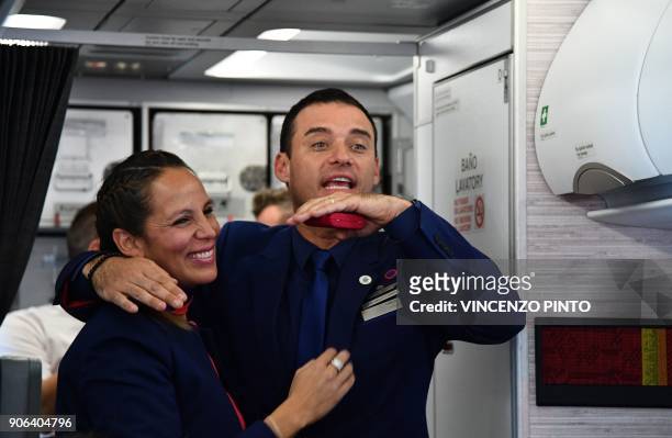 Crew members Paula Podest and Carlos Ciuffardi smile after being married by Pope Francis during the flight between Santiago and the northern city of...