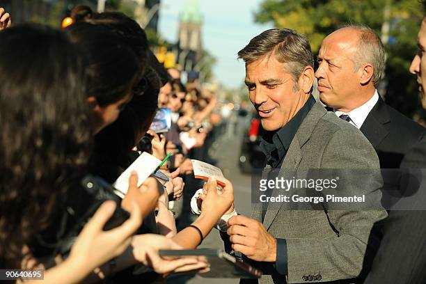 Actor George Clooney sings autographs at the "Up In The Air" Premiere held at the Ryerson Theatre during 2009 Toronto International Film Festival on...