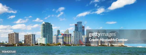 miami downtown brickell skyline sunny day extended panorama - miami skyline stock pictures, royalty-free photos & images