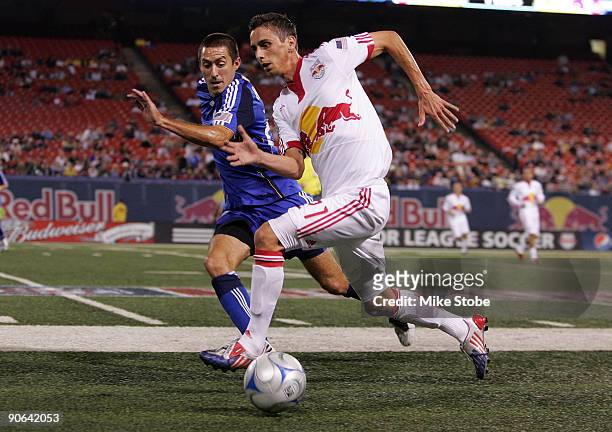 Davy Arnaud of the Kansas City Wizards and Ernst Oebster of the New York Red Bulls battle for control of the ball at Giants Stadium in the...