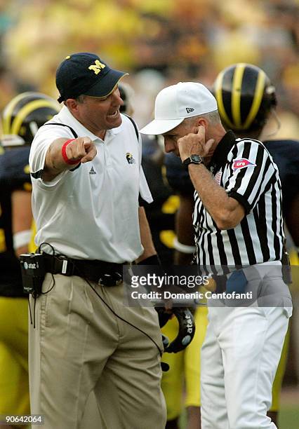 Michigan head coach Rich Rodriguez argues a call with an official in the second half against Notre Dame at Michigan Stadium on September 12, 2009 in...