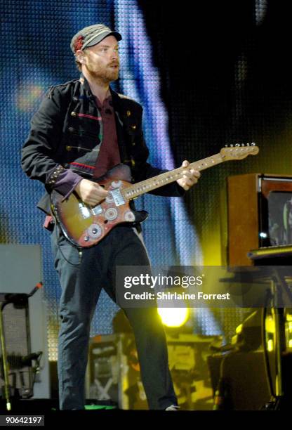 Jonny Buckland of Coldplay performs at Lancahire County Cricket Club on September 12, 2009 in Manchester, England.