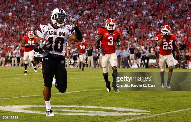 Tailback Brian Maddox of the South Carolina Gamecocks rushes in a touchdown against the Georgia Bulldogs at Sanford Stadium on September 12, 2009 in...