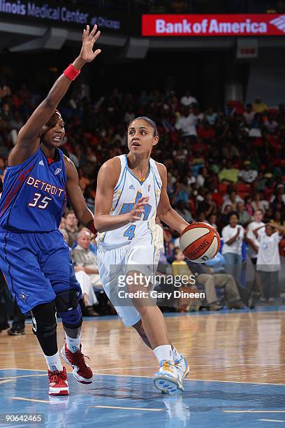 Candice Dupree of the Chicago Sky moves the ball past Cheryl Ford of the Detroit Shock during the WNBA game on September 12, 2009 at the UIC Pavilion...