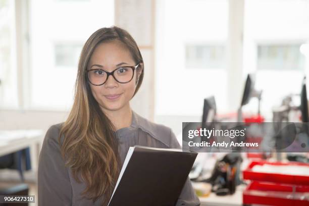 portrait of a young businesswoman - andy andrews stockfoto's en -beelden