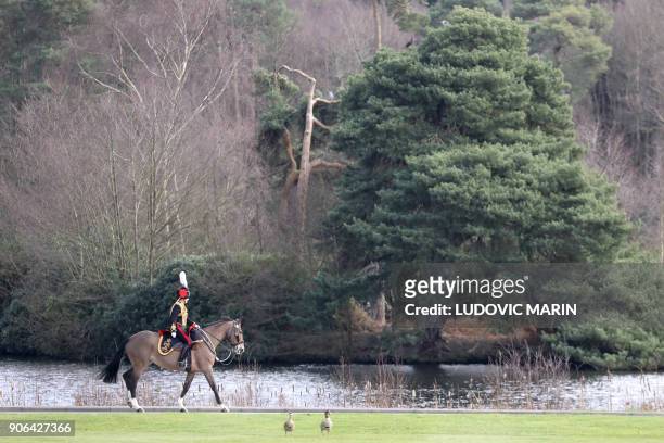 British military personel ride prior to the start of the Franco-British summit at the Royal Military Academy Sandhurst, west of London on January 18,...