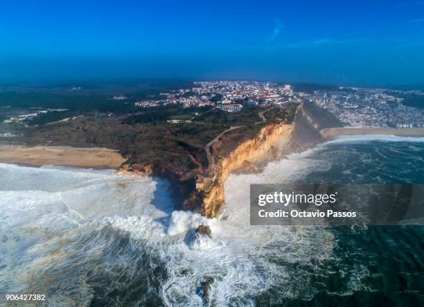 General view of Nazare lighthouse during a surf session at Praia do Norte on January 18, 2018 in Nazare, Portugal.