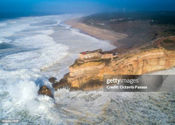 General view of Nazare lighthouse during a surf session at Praia do Norte on January 18, 2018 in Nazare, Portugal.