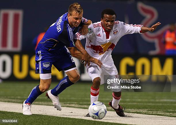 Michael Harrington of the Kansas City Wizards and Dane Richards of the New York Red Bulls battle for control of the ball at Giants Stadium in the...
