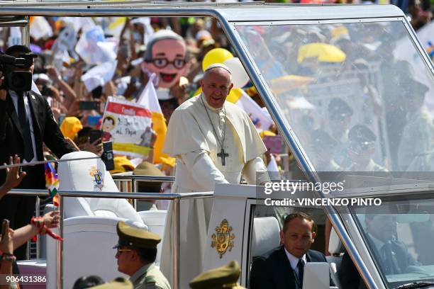 Pope Francis arrives on the popemobile at the site at Lobitos Beach, near the northern Chilean city of Iquique, where he will celebrate an open-air...