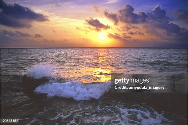 ocean wave sunset sky - ebb tide stock pictures, royalty-free photos & images