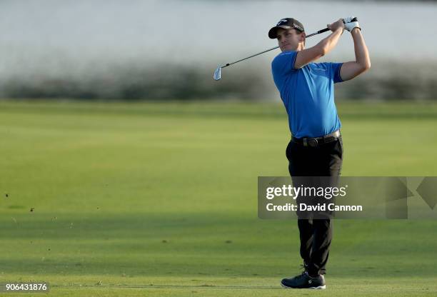 Chris Paisley of England plays his second shot on the par 4, 17th hole during the first round of the 2018 Abu Dhabi HSBC Golf Championship at the Abu...