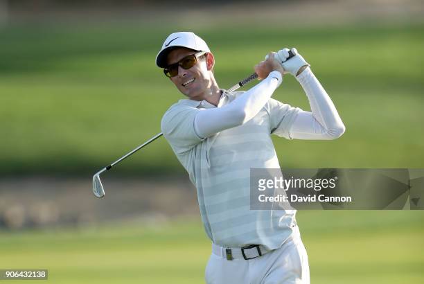 Dylan Frittelli of South Africa plays his second shot on the par 4, 17th hole during the first round of the 2018 Abu Dhabi HSBC Golf Championship at...