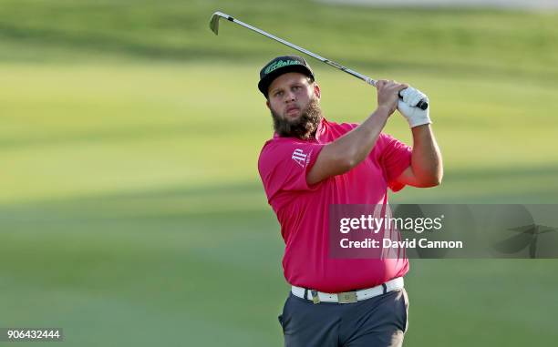 Andrew Johnston of England plays his second shot on the par 4, 17th hole during the first round of the 2018 Abu Dhabi HSBC Golf Championship at the...