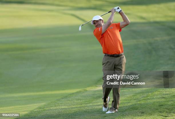 Jose Maria Olazabal of Spain plays his second shot on the par 4, 17th hole during the first round of the 2018 Abu Dhabi HSBC Golf Championship at the...