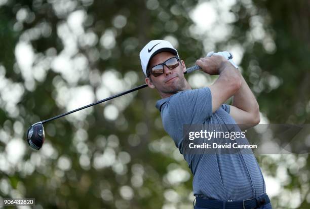 Paul Casey of England plays his tee shot on the par 4, 17th hole during the first round of the 2018 Abu Dhabi HSBC Golf Championship at the Abu Dhabi...